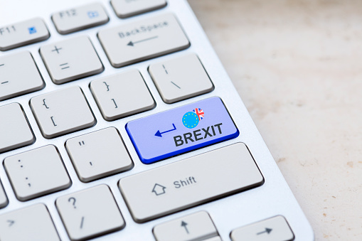 Blue key Enter United Kingdom Brexit with EU keyboard button on modern text communication board