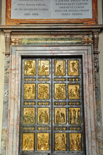 View from outside of the Holy Door of St. Peter's Basilica. St. Peter's Basilica is an Italian Renaissance church in Vatican City and the papal residence within the city of Rome, Italy.