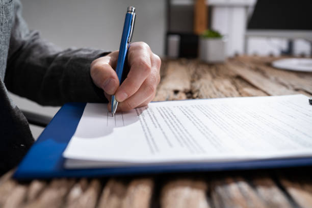 istock Lawyer Signing Legal Form 1285808617