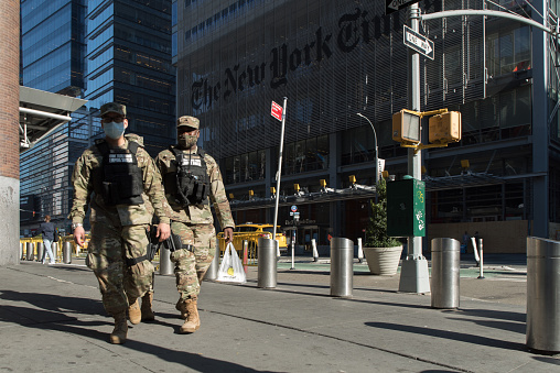 Manhattan, New York. November 09, 2020. Empire shield soldiers walk in front of the 