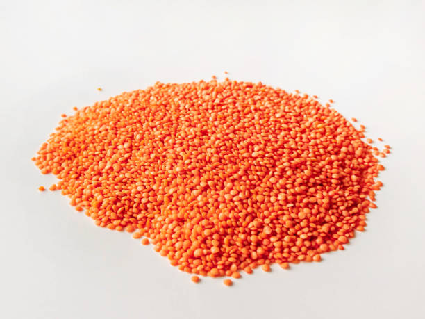 istock A pile of lentils on a white table top side view 1285809874