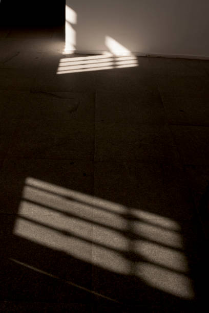istock Interior of room with shadows and lights 1285811258