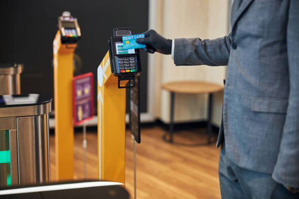 istock Person paying with a card for passing through turngate 1285812484
