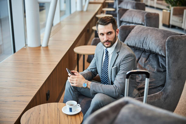 istock Troubled businessman with a smartphone in his hands 1285812540