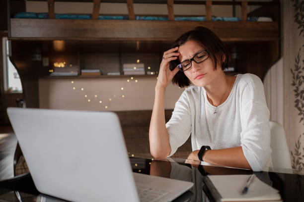 istock Upset asian woman working from home office. 1285813661