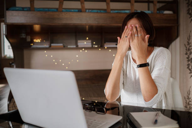 istock Upset asian woman working from home office. 1285813968
