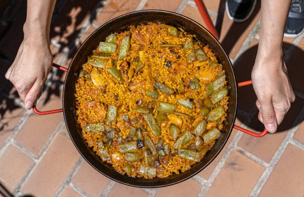 istock Paella from Spain chicken and rabbit rice recipe from Valencia 1285819077