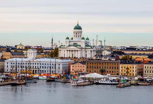 This image shows panorama of Cityscape of Helsinki with Cathedral, South Harbor and Market Square along with all city skyline.
