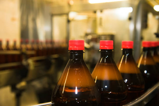istock Plastic bottles with a carbonated drink on the conveyor 1285821614