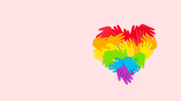 Tolerance, kindness, cooperative, friendship, charity humanitarian aid day concept. Many rainbow color palm hands on pink background with copy space Tolerance, kindness, cooperative, friendship, charity humanitarian aid day concept. Many rainbow color palm hands on pink background with copy space. human rights act stock pictures, royalty-free photos & images