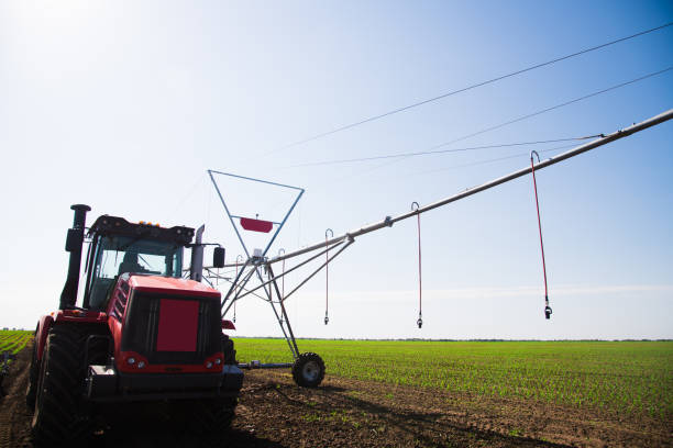 istock Modern agricultural irrigation system spraying in field 1285822449