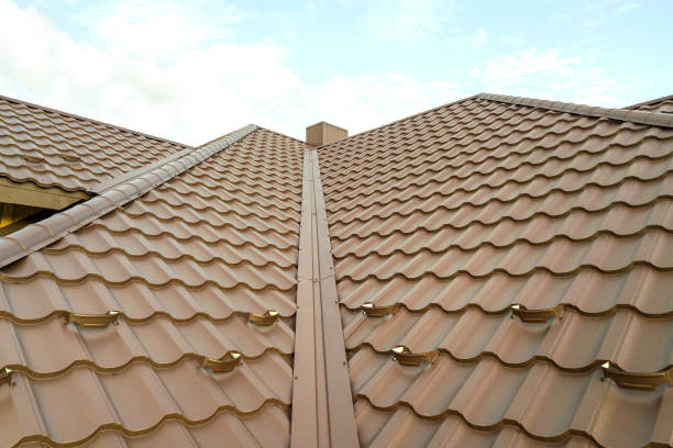 istock House roof surface covered with brown metal tile sheets. 1285823872
