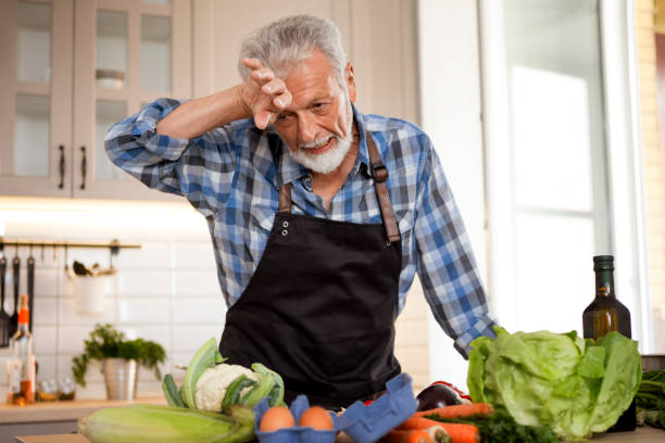 istock Senior man getting tired cooking 1285825605