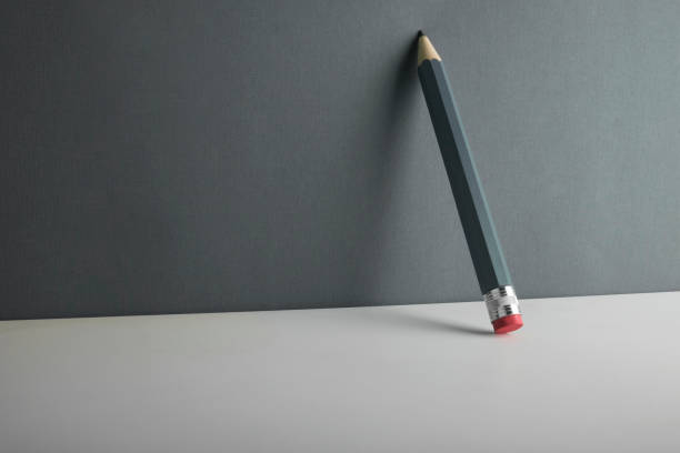 istock Pencil leaning against the wall. 1285826038
