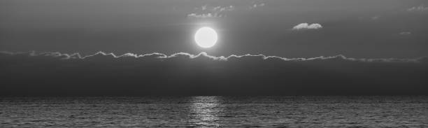 istock Beautiful sunset over the Baltic Sea. Black and white image. 1285826277