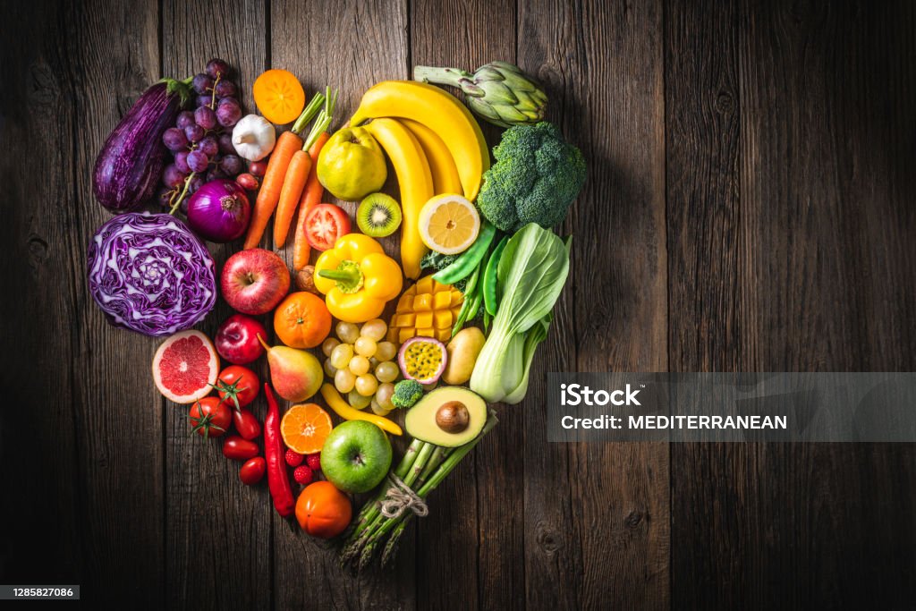 Vegetables and fruit with heart shape as concept of cardiovascular health Vegetables and fruit with heart shape as concept of cardiovascular health on wooden rustic table Vegetable Stock Photo