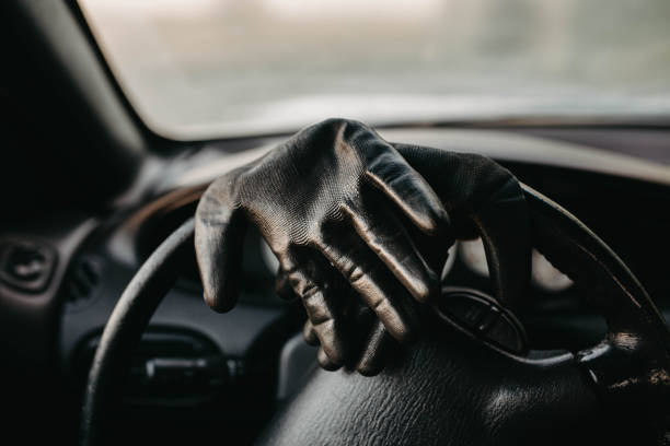 istock driver's gloves on the steering wheel 1285827183
