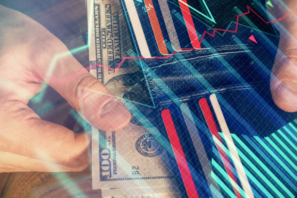 istock Multi exposure of forex graph drawing hologram and USA dollars bills and man hands. Technical Analysis concept. 1285827404