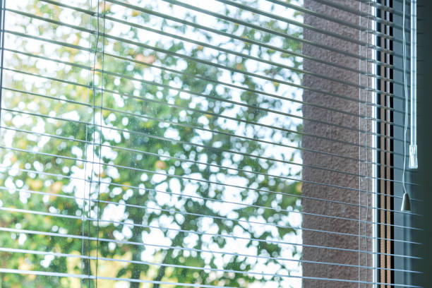 istock soft sun light through open windows venetian blinds illuminate home bedroom or office room in morning 1285827514