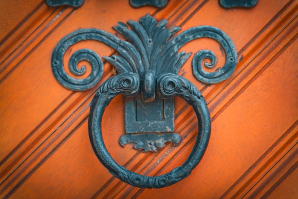 istock Vintage and ornate, iron ring shaped doorknocker 1285830235