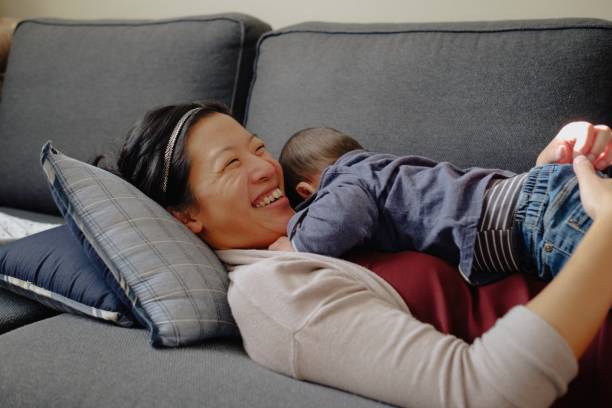 istock Mother plays with baby 1285832480