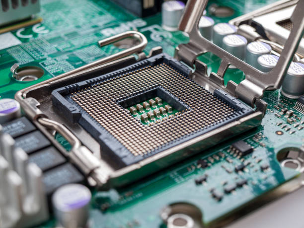 istock CPU connector on the circuit motherboard with pressure contacts for connecting a silicon microprocessor, CPU selection during computer assembly 1285833779