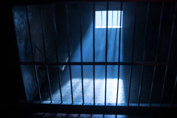 istock Jail or prison cell. Old grunge prison miniature. Dark prison interior creative decoration. Empty cell. Selective focus Obsolete gray grunge concrete room. 1285836085