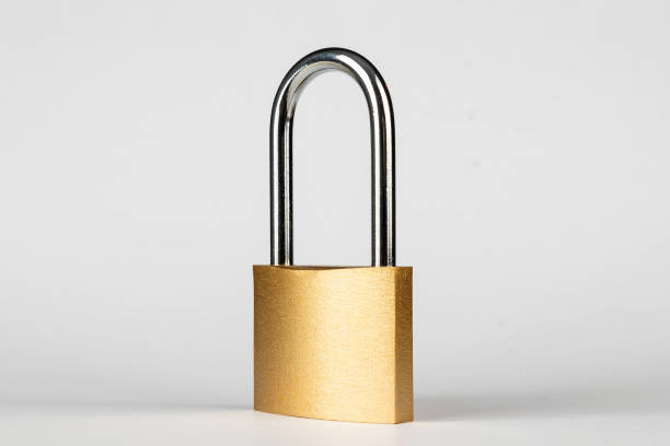 istock Padlock gold padlock isolated on white background. 1285837110