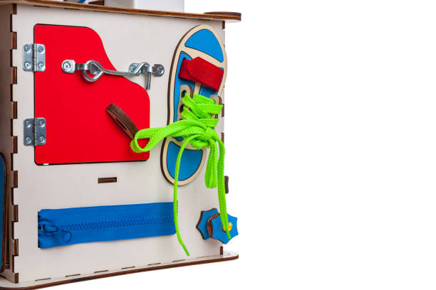 istock children's educational toy busycube, busyboard, isolated on a white background, the development of motor skills and coordination in kids, design 1285837186