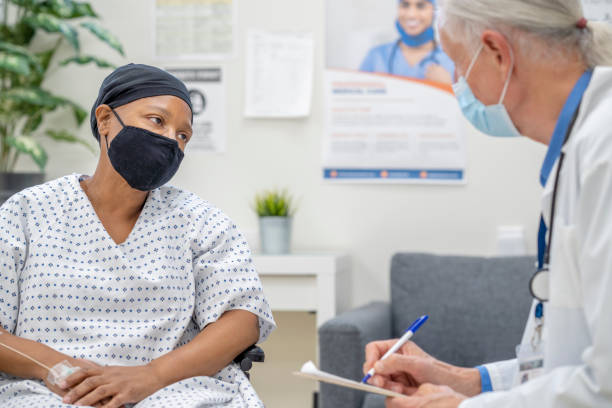 istock Senior oncology patient meeting with her doctor 1285837363