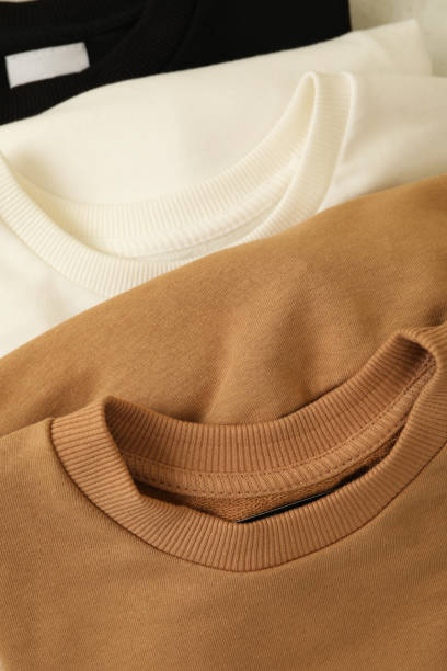 istock Three stylish blank folded sweatshirts, close up 1285839031