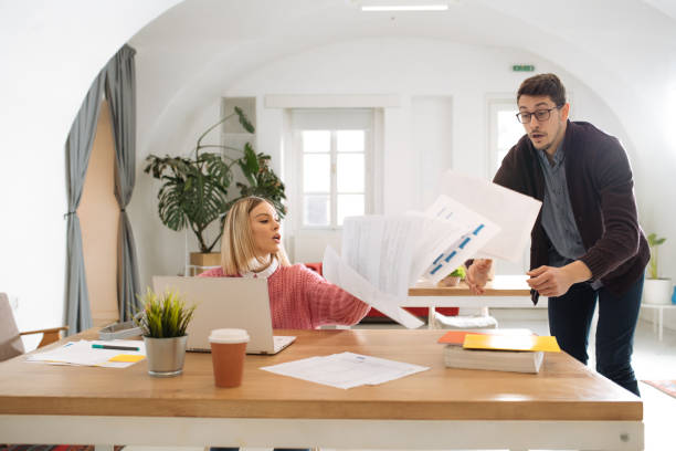 istock Businessman dropping paperwork before approaching his colleagues 1285839786