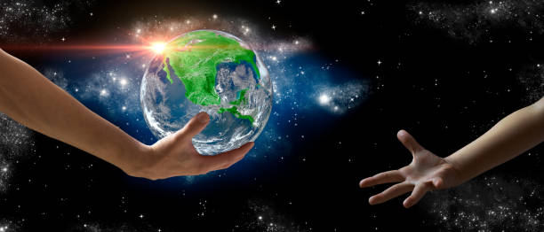 Man's hands delivering Planet Earth into a girl's hands. Save the planet. Concept of ecology. Elements of this image furnished by NASA stock photo