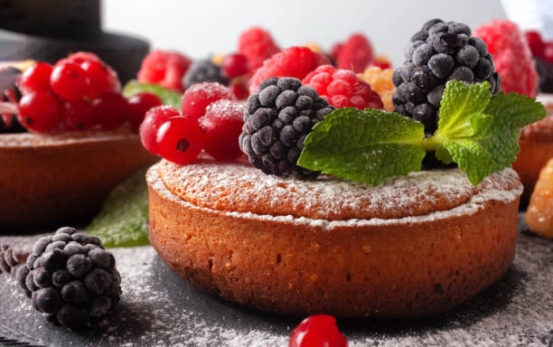 istock Fresh small homemade fruit tarts with raspberries, currants and blackberries 1285846584