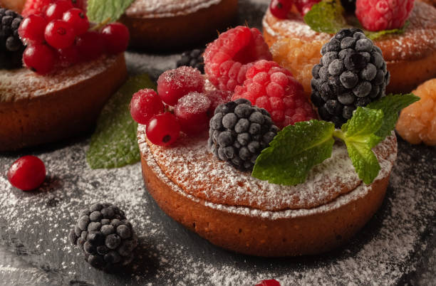 istock Fresh small homemade fruit tarts with raspberries, currants and blackberries 1285846591