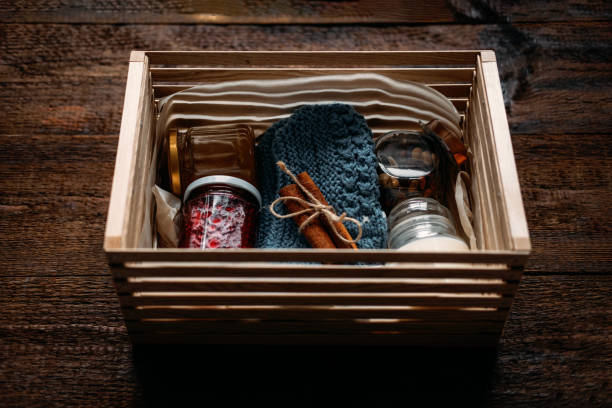 istock Care box, package ideas. Fall or Winter care box with sweets and warm clothes. Care Package Delivery, Fall Winter holidays Food Care gift box 1285847455