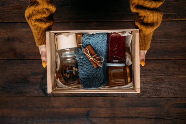 istock Care box, package ideas. Fall or Winter care box with sweets and warm clothes. Care Package Delivery, Fall Winter holidays Food Care gift box 1285847459