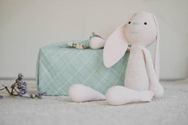 istock Furoshiki Japanese Gift fabric Wrapping and knitted toy rabbit. Zero waste, eco-friendly gift wrapping box. Fall hand-wrapped gift in traditional Japanese Furoshiki style 1285847642