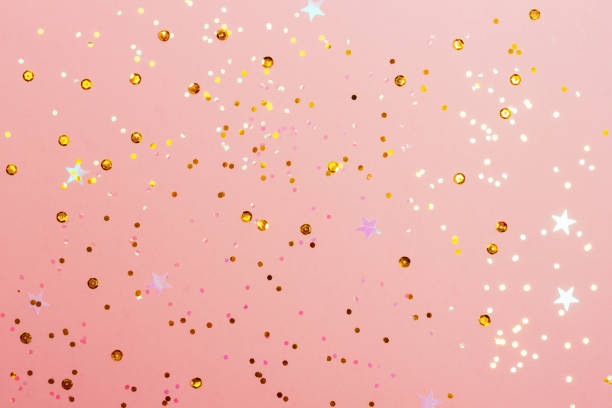 istock Festive pastel pink background with confetti. 1285848333