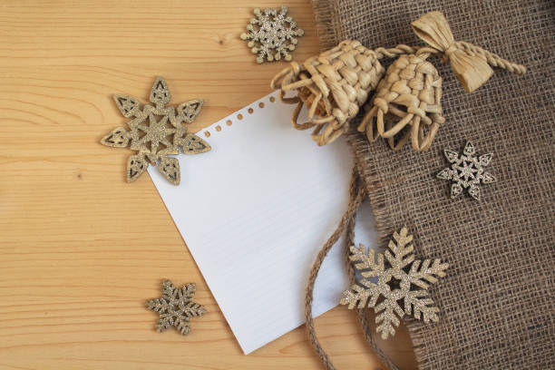 istock Snowflakes and bells on a wooden surface. Christmas decorations 1285848637