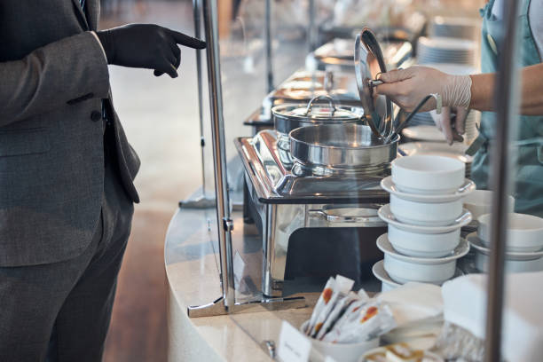 istock Diner cashier opening a soup pot for a customer 1285853961