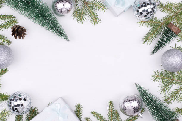 istock Frame of Christmas decorations on a white background,tree branches, cones, gifts Flatlay, CopySpace, New year 2021 1285857382