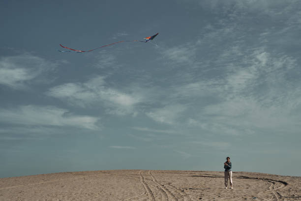istock The girl launches a kite. Camping, hobby. 1285857700
