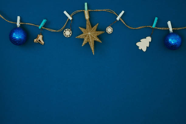 istock Christmas garland on a blue background. New Year's decor. Copy space, mock up. 1285857802