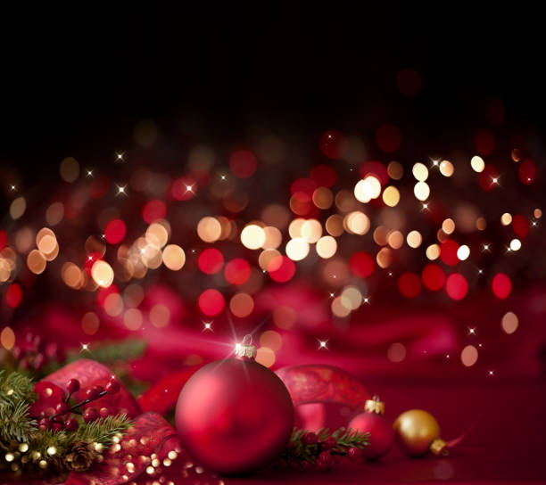 istock Christmas Red Bauble on a Red and Black Background 1285859772