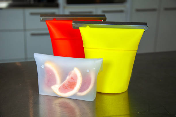 Three zero-waste food-grade silicone food bags to hold snacks or dried goods to replace plastic zip-lock style bags stock photo