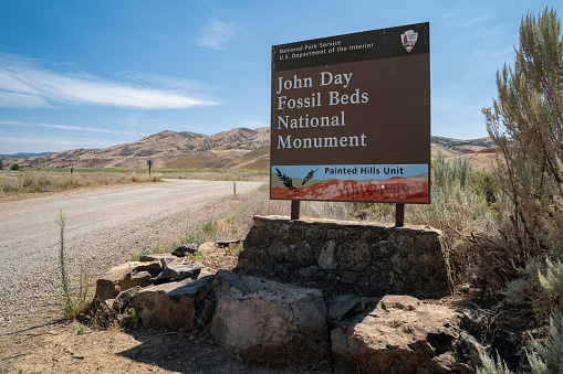Mitchell, Oregon - August 2, 2020: John Day Fossil Beds Painted Hills National Monument Sign in summertime