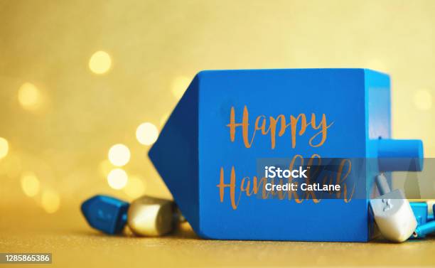 Hanukkah Background With Dreidel On Gold And Happy Hanukkah Message Stock Photo - Download Image Now