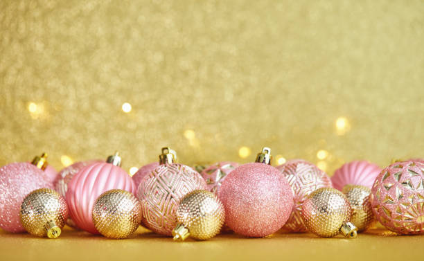 istock Glittering Christmas Background with Pink and Gold Decorations 1285867151