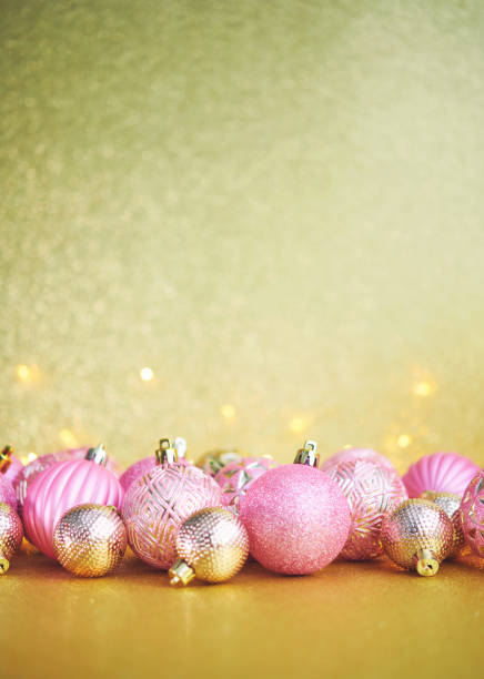 istock Glittering Christmas Background with Pink and Gold Decorations 1285867185
